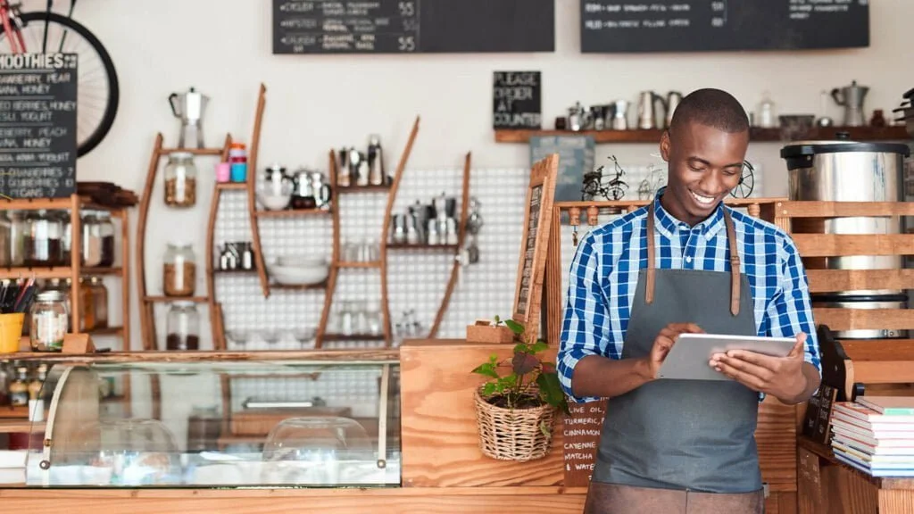 small business owner on tablet stock